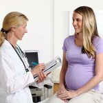 Pregnant woman at doctor&#39;s appointment